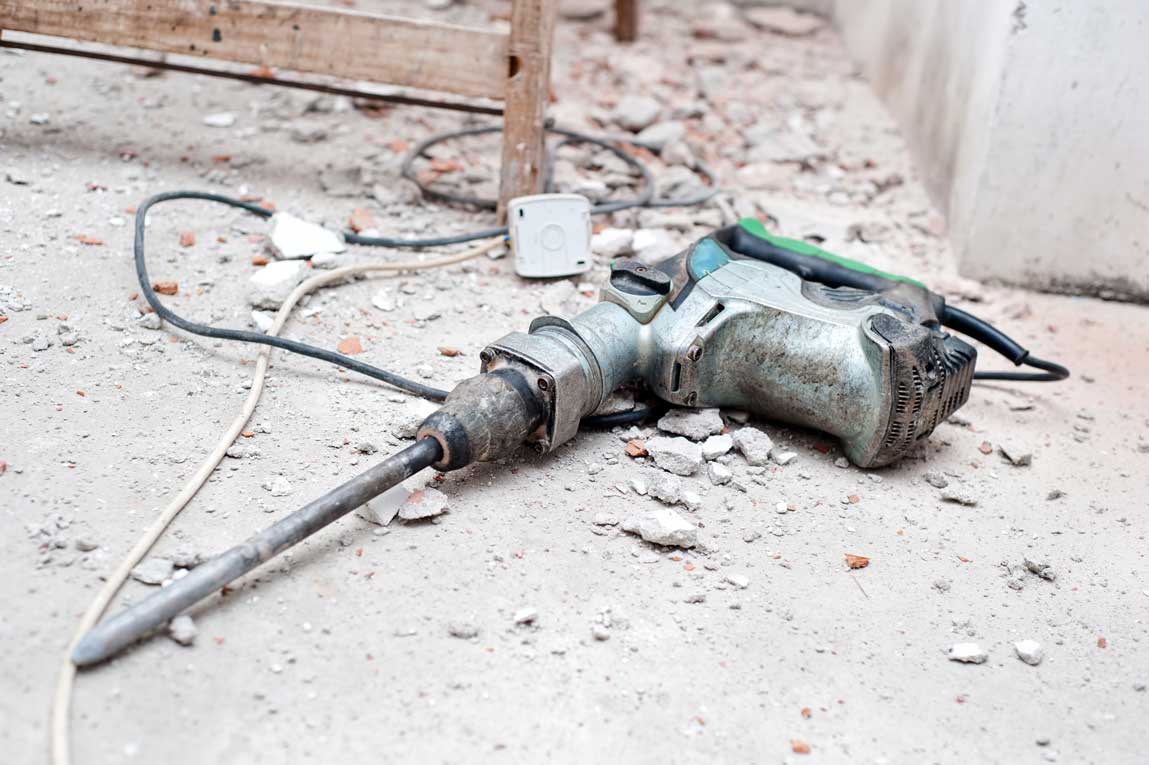 Construction Tool, The Jackhammer With Demolition Debris